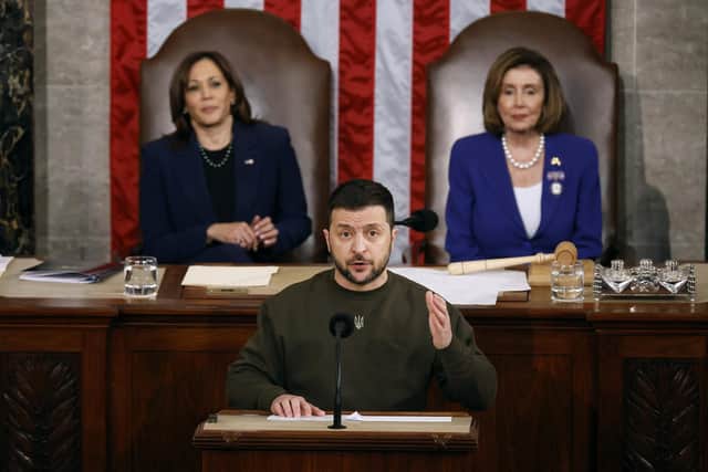 U.S. Vice President Kamala Harris (L) and Speaker of the House Nancy Pelosi (D-CA) listen to President of Ukraine Volodymyr Zelensky addresses a joint meeting of Congress in the House Chamber of the U.S. Capitol on December 21, 2022 in Washington, DC