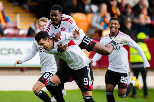 Aberdeen's Bojan Miovski (C) celebrates scoring the opener in the 2-1 win over Motherwell. (Photo by Craig Foy / SNS Group)