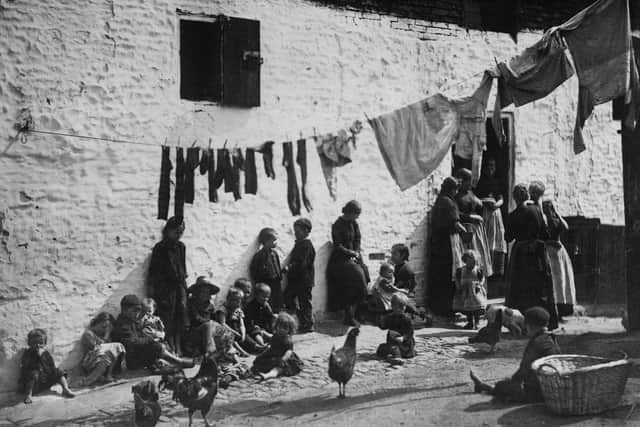 A busy courtyard in a slum area of London in 1889 (Pictures: General Photographic Agency/Getty Images)