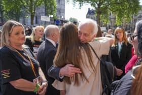 Chairman of the infected blood inquiry Sir Brian Langstaff with victims and campaigners outside Central Hall in Westminster, London, after the publication of the Inquiry report. Picture: Jeff Moore/PA Wire