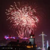 Fireworks explode over Edinburgh Castle and the Balmoral Clock during the street party for Hogmanay New Year celebrations in Edinburgh. Picture: Jane Barlow/PA Wire