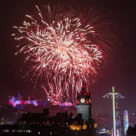 Fireworks explode over Edinburgh Castle and the Balmoral Clock during the street party for Hogmanay New Year celebrations in Edinburgh. Picture: Jane Barlow/PA Wire
