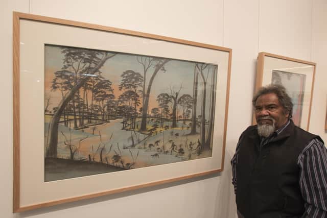 Goreng Noongar Elder Ezzard Flowers with some of the Carrolup artworks. Picture: Brad Coleman