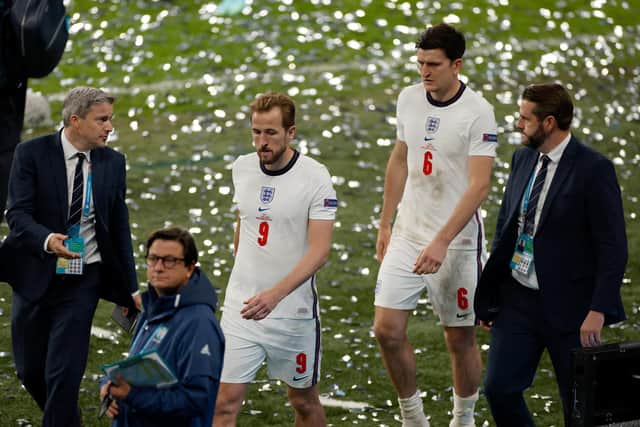 England's Harry Kane and Harry Maguire look dejected following defeat to Italy in the final of Euro 2020. (Photo by John Sibley - Pool/Getty Images)
