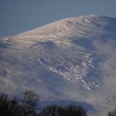 Dave Wright took the photo of the snow giving way and falling down the hill earlier this week, but he says the risks are still real.