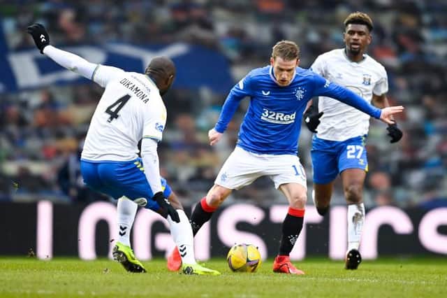 Rangers' Steven Davis (R) is closed down by Kilmarnock's Clevid Dikamona during a Scottish Premiership match between Rangers and Kilmarnock at Ibrox Stadium, on February 13, 2021, in Glasgow, Scotland. (Photo by Rob Casey / SNS Group)
