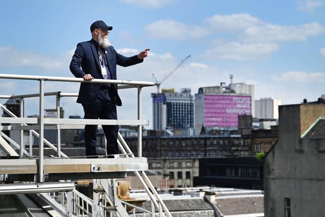 Paul Lyons on a Glasgow Central roof walkway with the view towards the former Glasgow College of Building and Printing building near George Square. Picture: John Devlin