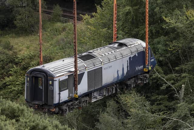 The end section of the ScotRail train being moved by crane today. Picture: Derek Ironside/Newsline Media/PA Wire