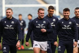 Scotland captain Stuart Hogg is flanked in training by Finn Russell, left, and Ali Price.  (Photo by Craig Williamson / SNS Group)