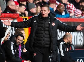 Barry Robson, Aberdeen's interim boss, had his name sung by the Dons support. (Photo by Paul Byars / SNS Group)