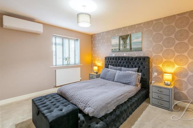 And so to the two bedrooms, the first of which is a lovely, warm space. It boasts fitted wardrobes, a storage cupboard, a carpeted floor and even air conditioning, which must be bliss during those hot summer nights in bed.