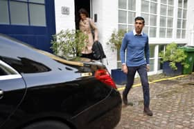 Rishi Sunak outside his home in London on Saturday morning.  He is believed to have become the first Conservative leadership candidate to secure the backing of 100 MPs, shoring up sufficient support to be on the ballot for Monday's vote. Beresford Hodge/PA Wire