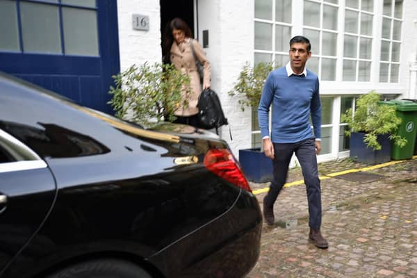 Rishi Sunak outside his home in London on Saturday morning.  He is believed to have become the first Conservative leadership candidate to secure the backing of 100 MPs, shoring up sufficient support to be on the ballot for Monday's vote. Beresford Hodge/PA Wire