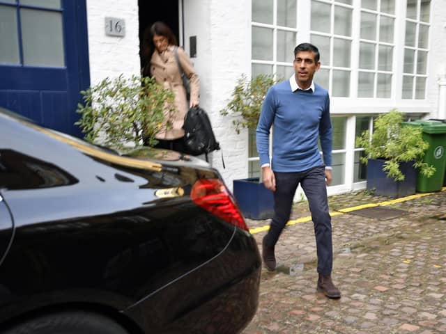 Rishi Sunak outside his home in London on Saturday morning.  He is believed to have become the first Conservative leadership candidate to secure the backing of 100 MPs, shoring up sufficient support to be on the ballot for Monday's vote. Beresford Hodge/PA Wire