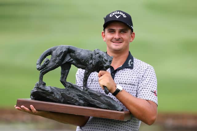 Christiaan Bezuidenhout celebrates with the trophy following his victory in the Alfred Dunhill Championship at Leopard Creek. Picture: Richard Heathcote/Getty Images