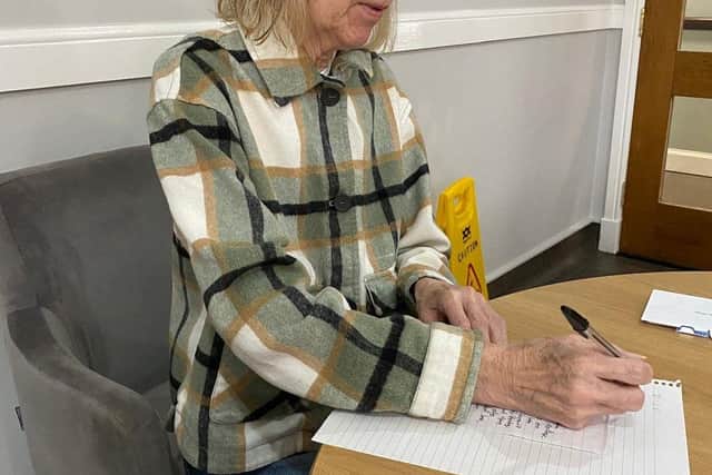 Another resident writes a letter to a student