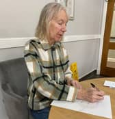 Another resident writes a letter to a student