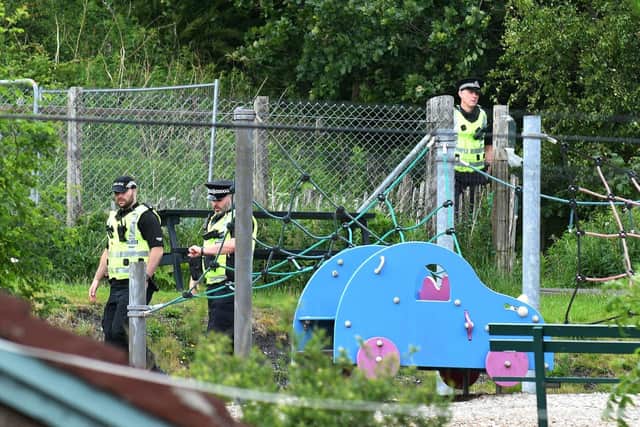 Police continue their investigations in Coneypark Crescent near a playpark and allotments close to Glenskirlie Castle. Pic: Michael Gillen