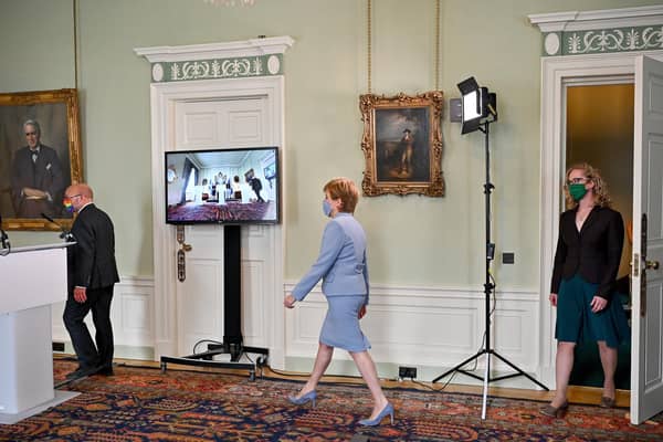 First Minister Nicola Sturgeon (centre) and Scottish Green Party co-leaders Patrick Harvie (left) and Lorna Slater (right) at Bute House, Edinburgh, after the finalisation of an agreement between the SNP and the Scottish Greens to share power in Scotland. Picture: PA