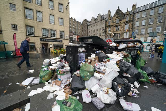 Overflowing bins in the Grassmarket area of Edinburgh where cleansing workers from the City of Edinburgh Council are on the fourth day of eleven days of strike action.