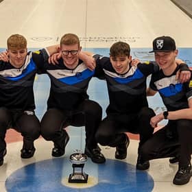 James Craik (far left) and his team with the World Junior Curling Championship trophy.