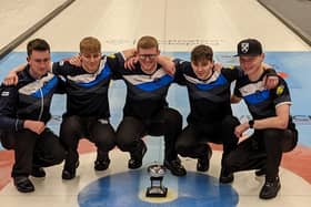James Craik (far left) and his team with the World Junior Curling Championship trophy.