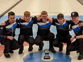 James Craik (far left) and his team with the World Junior Curling Championship trophy.