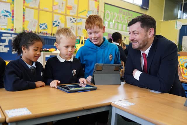 Edinburgh Council Leader Cammy Day visits Carrick Knowe Primary School, where pupils have benefited from a local authority scheme to distribute digital devices. Image: Stewart Attwood Photography 2023.