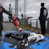 Protesters from Ocean Rebellion demonstrate next to an oil platform on the banks of the river Tay, calling for a halt to plans to open the giant Rosebank oil field, off Shetland, which could yield up to 500 million barrels of oil. Picture: Jeff J Mitchell/Getty Images