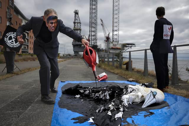 Protesters from Ocean Rebellion demonstrate next to an oil platform on the banks of the river Tay, calling for a halt to plans to open the giant Rosebank oil field, off Shetland, which could yield up to 500 million barrels of oil. Picture: Jeff J Mitchell/Getty Images