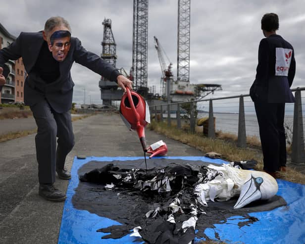 Protesters from Ocean Rebellion demonstrate next to an oil platform on the banks of the river Tay, calling for a halt to plans to open the giant Rosebank oil field, off Shetland, which could yield up to 500 million barrels of oil. Picture: Jeff J Mitchell/Getty Images