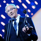 Paul O'Grady collecting the best Factual Entertainment programme award on stage during the 2014 National Television Awards at the O2 Arena, London.