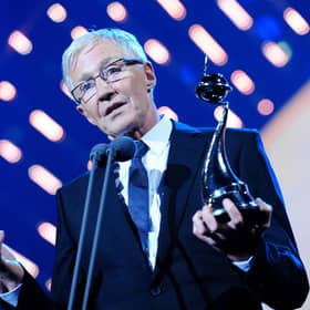 Paul O'Grady collecting the best Factual Entertainment programme award on stage during the 2014 National Television Awards at the O2 Arena, London.