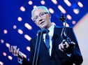 Paul O'Grady collecting the best Factual Entertainment programme award on stage during the 2014 National Television Awards at the O2 Arena, London.