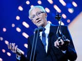 Paul O'Grady collecting the best Factual Entertainment programme award on stage during the 2014 National Television Awards at the O2 Arena, London.