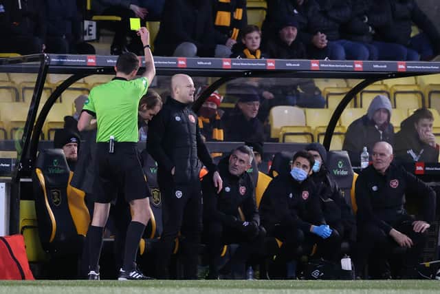 Robbie Neilson is booked by Kevin Clancy.