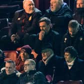 Motherwell manager Graham Alexander watches on from the stand.
