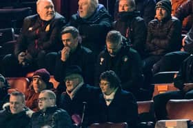 Motherwell manager Graham Alexander watches on from the stand.