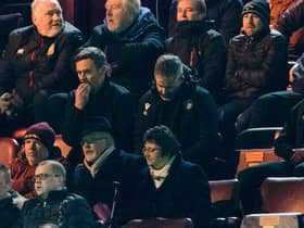 Motherwell manager Graham Alexander watches on from the stand.