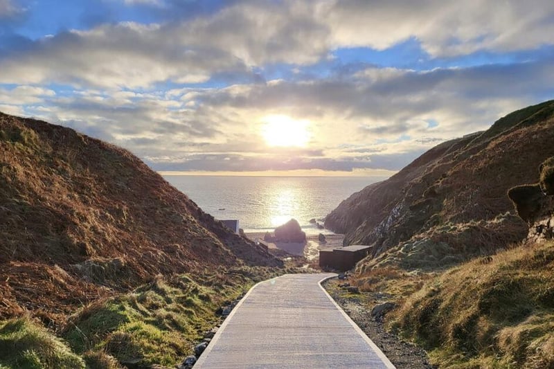 A private road leads to the luxurious coastal cottage.