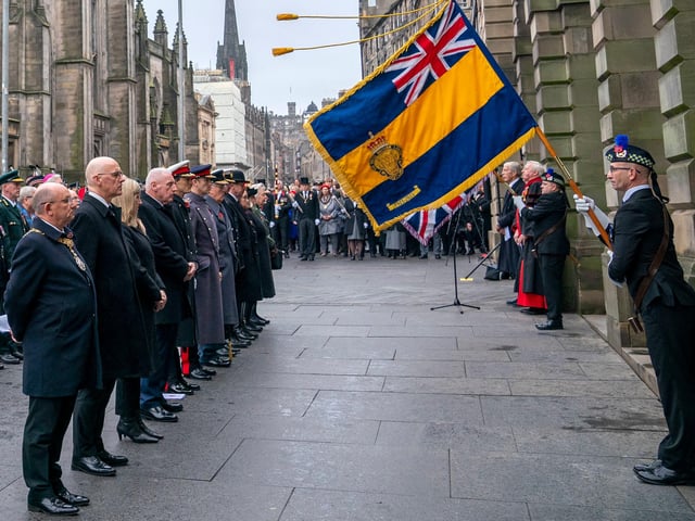 Standard bearer during the Remembrance Sunday ceremony at the Stone of Remembrance outside the City Chambers in Edinburgh.