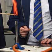 Pupils perform a science experiment.