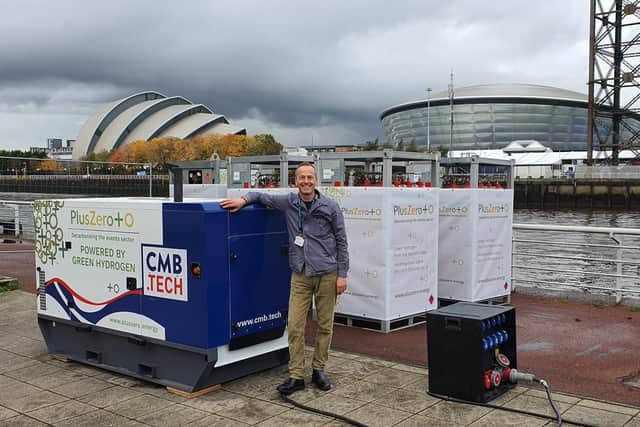 David Amos, founder of PlusZero, with a green hydrogen generator used to supply portable power at the COP26 climate summit in Glasgow