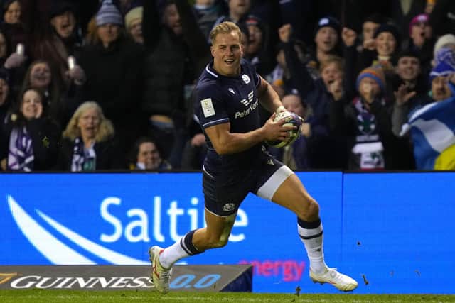 Scotland's Duhan van der Merwe runs in his third try during a momentous evening for the winger.