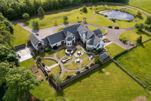Aerial view of house and gardens.