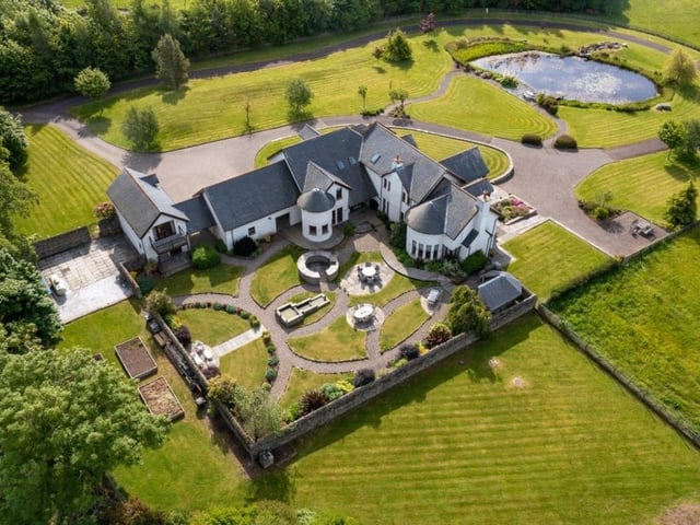 Aerial view of house and gardens.