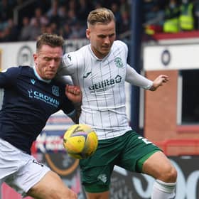 Hibs debutant James Scott battles for the ball with Dundee defender Lee Ashcroft