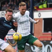 Hibs debutant James Scott battles for the ball with Dundee defender Lee Ashcroft