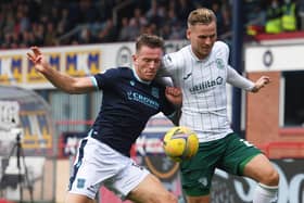 Hibs debutant James Scott battles for the ball with Dundee defender Lee Ashcroft