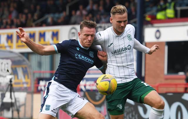 Hibs debutant James Scott battles for the ball with Dundee defender Lee Ashcroft